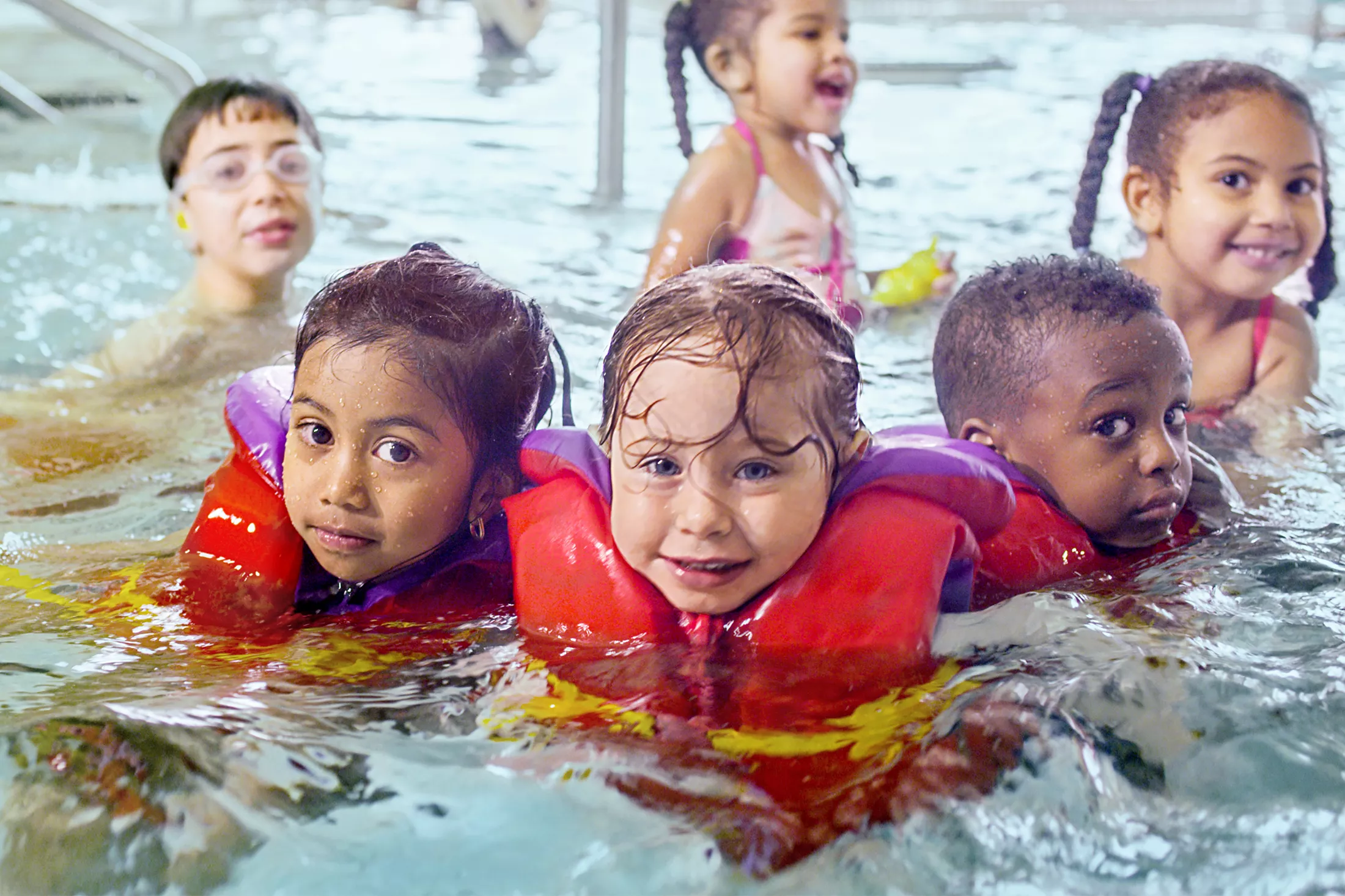 Group of Young Kids in Swimming Lessons