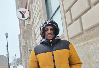 Zakariya in front of the Downtown Y