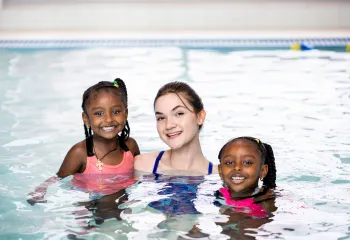 Image of swim instructor with two girls in a pool