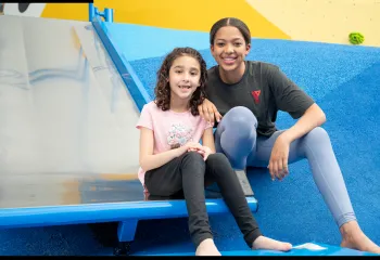 Two girls smiling at the camera