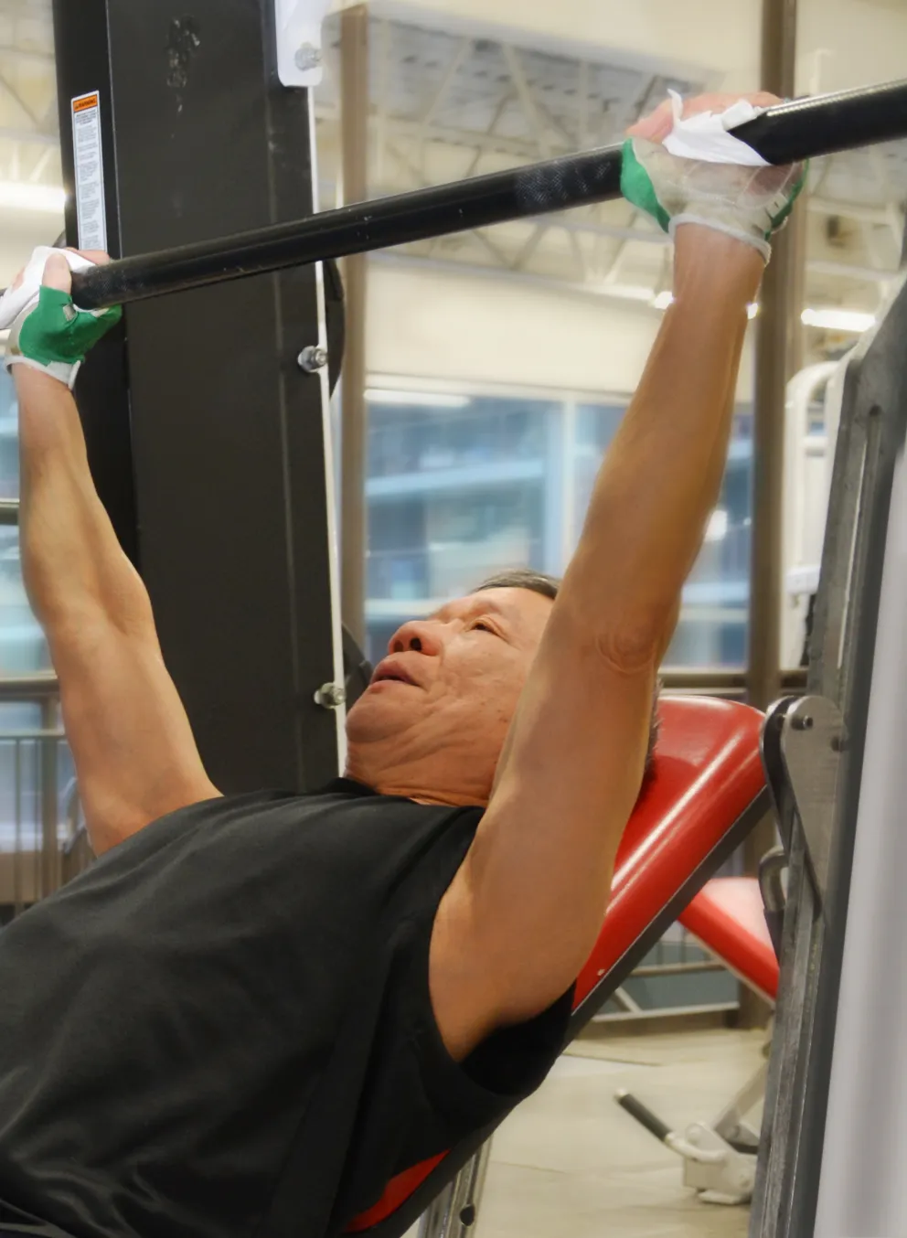 Man Lifting Weights at Downtown Y