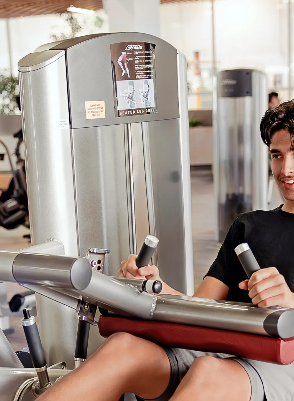 Teen boy using fitness centre at West Portage Y
