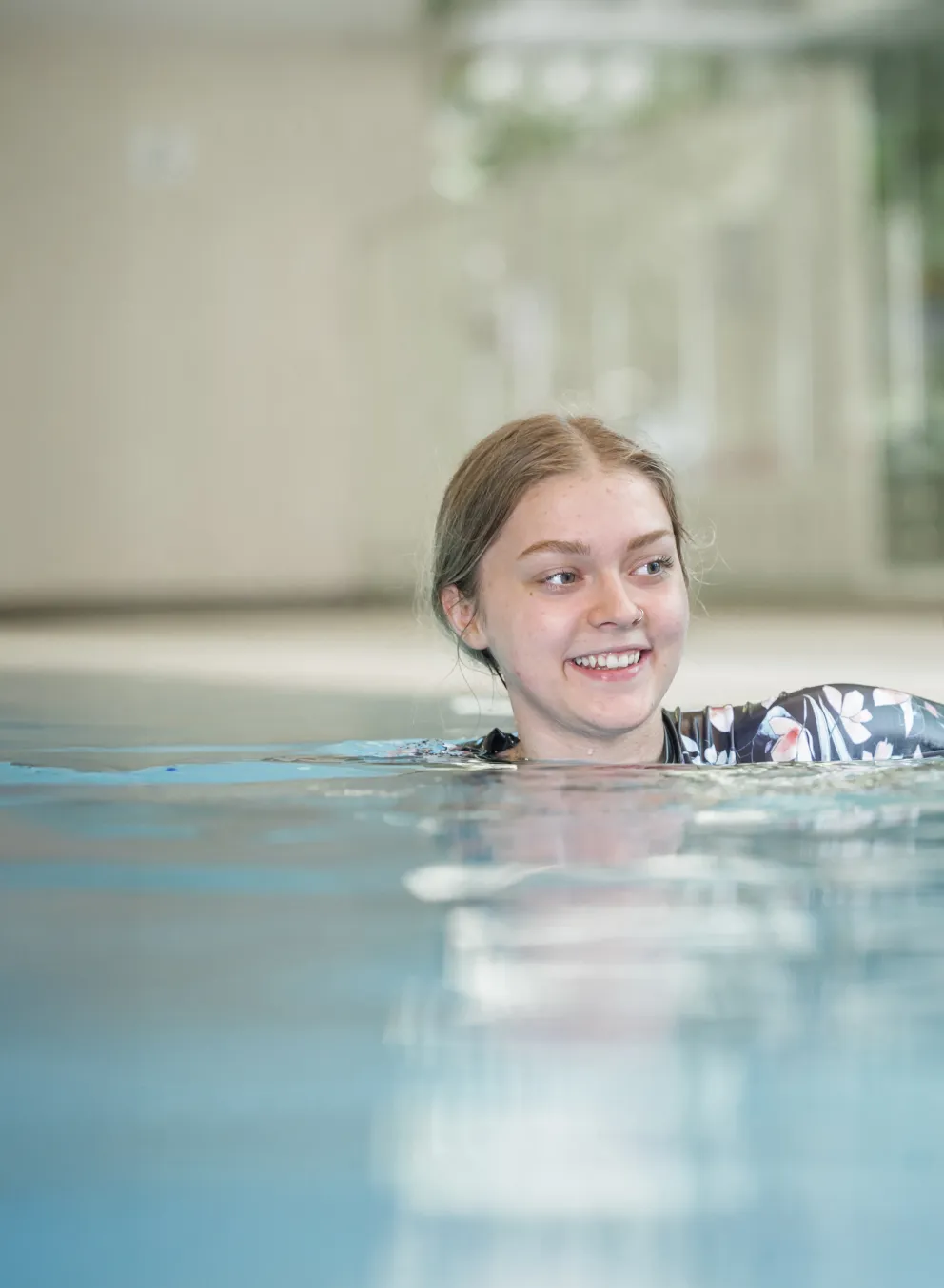 Two teen girls enjoy the pool