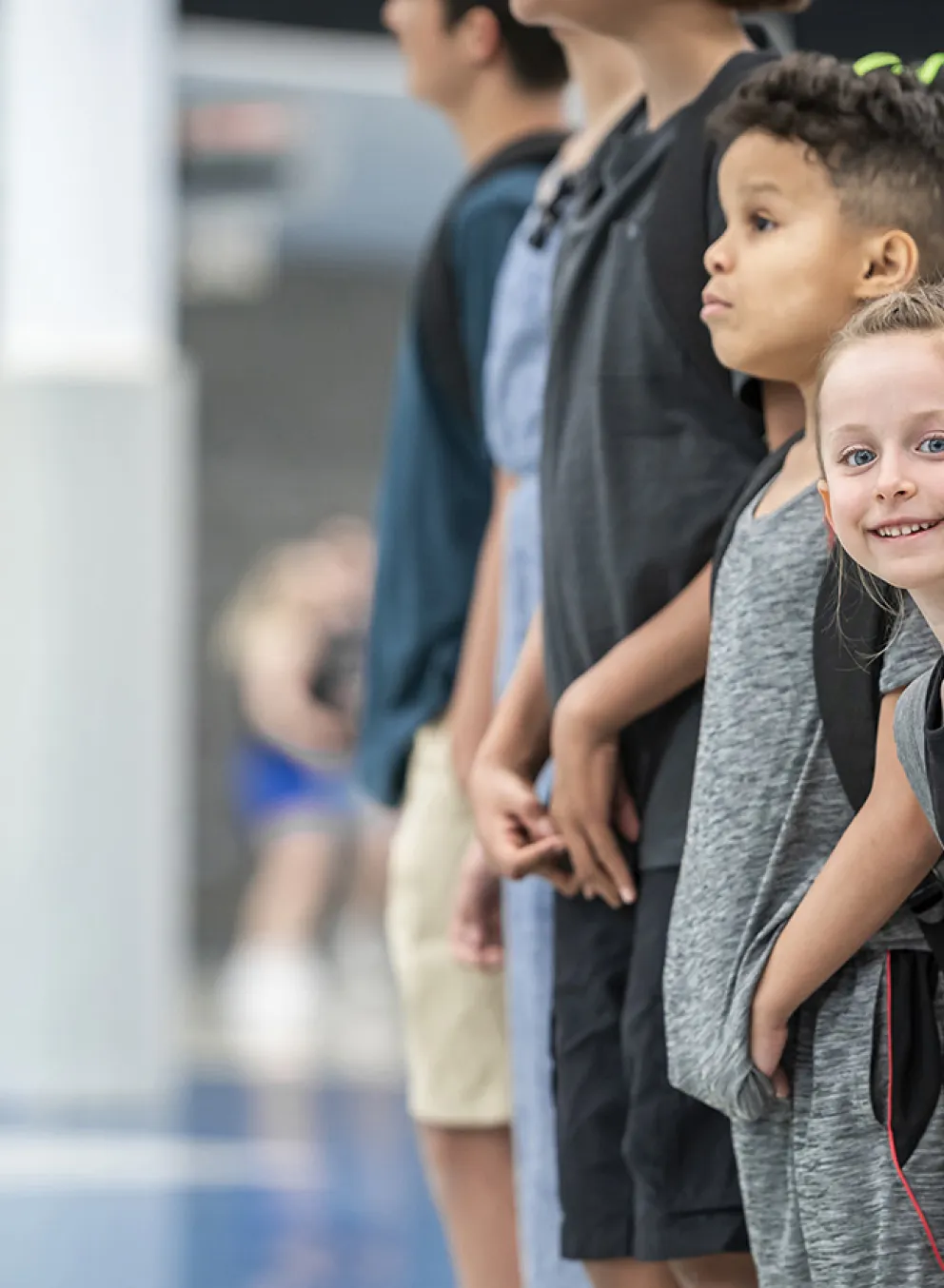 smiling youth with backpacks