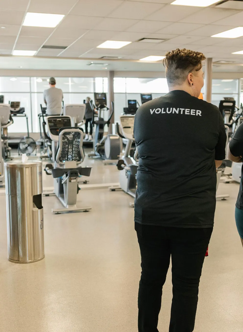 2 Y Volunteers talking, smiling with each other