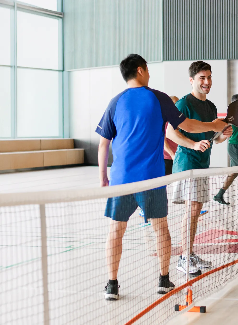 group of members playing pickleball