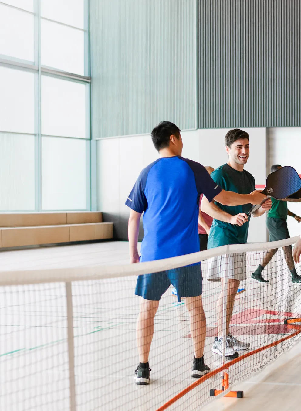 group of adults playing pickleball at the Y