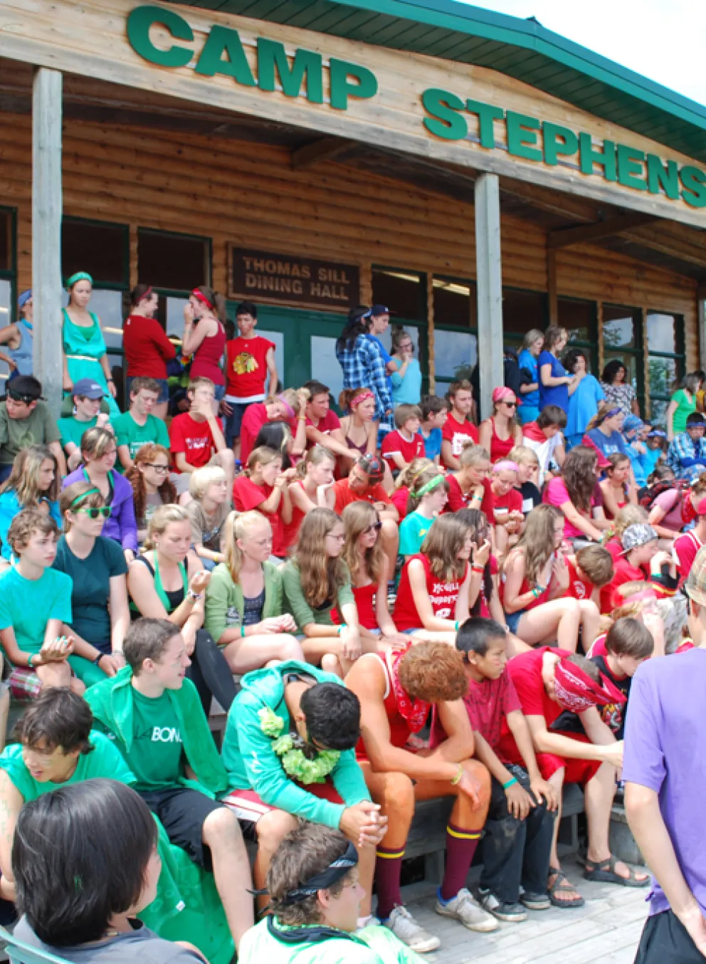large group of students in front of Camp building
