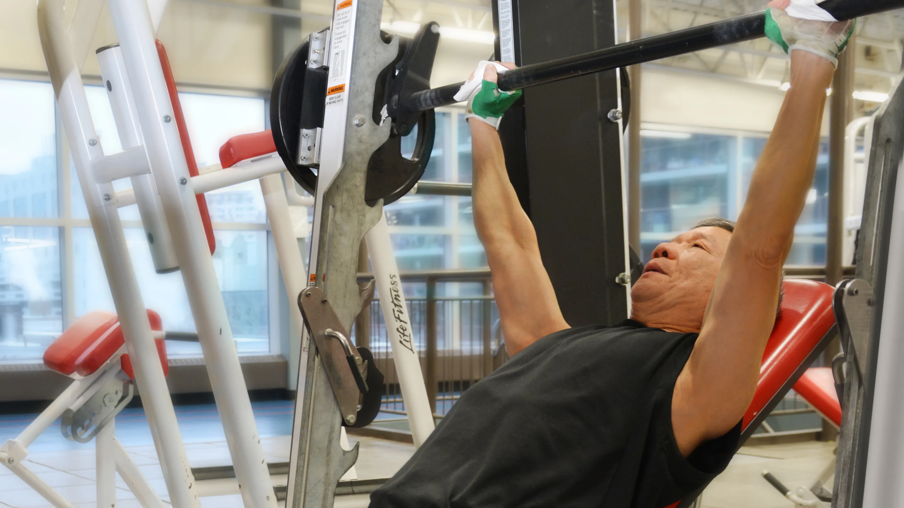 Man Lifting Weights at Downtown Y