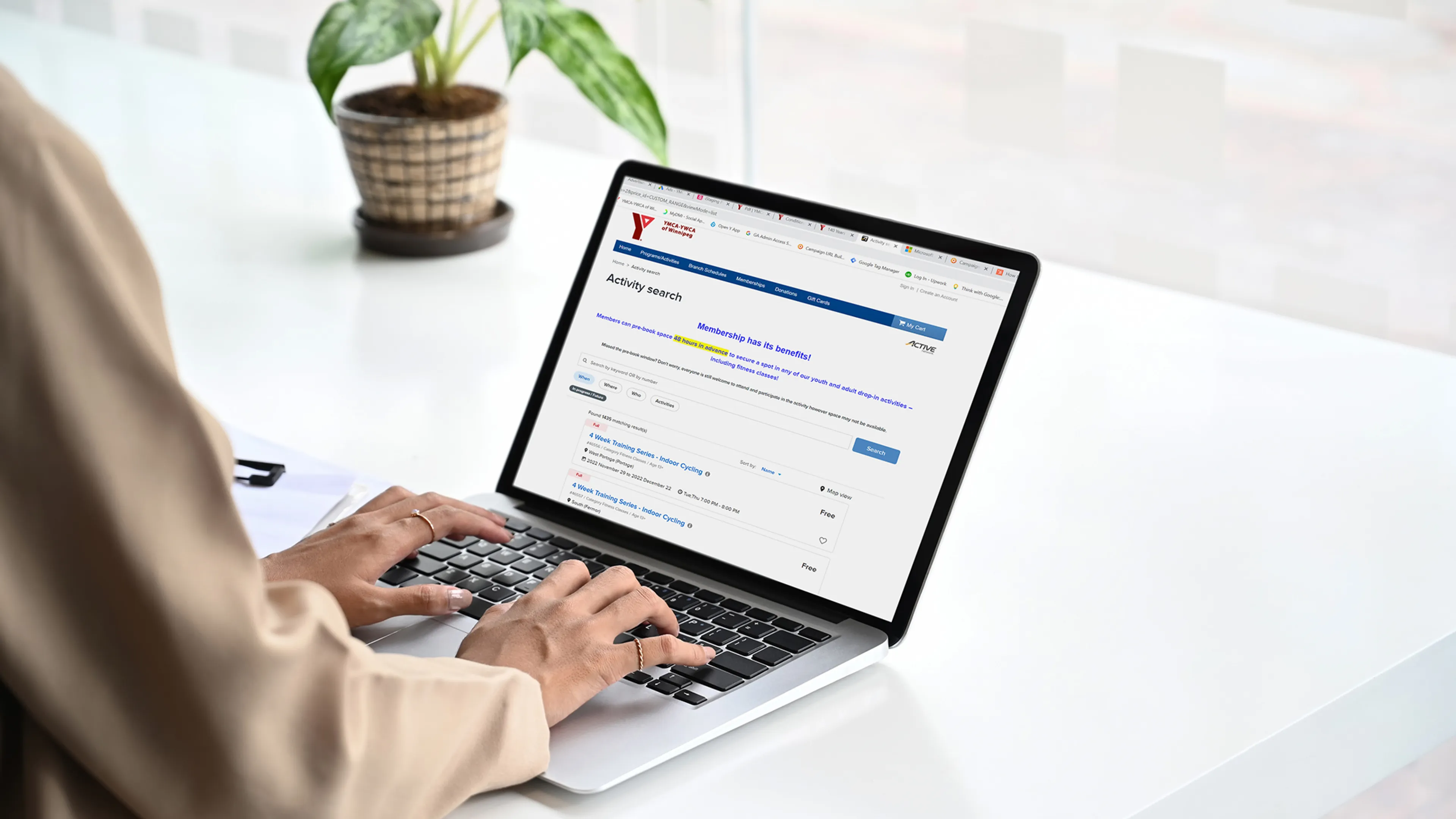 Woman Using our Online Registration on Laptop