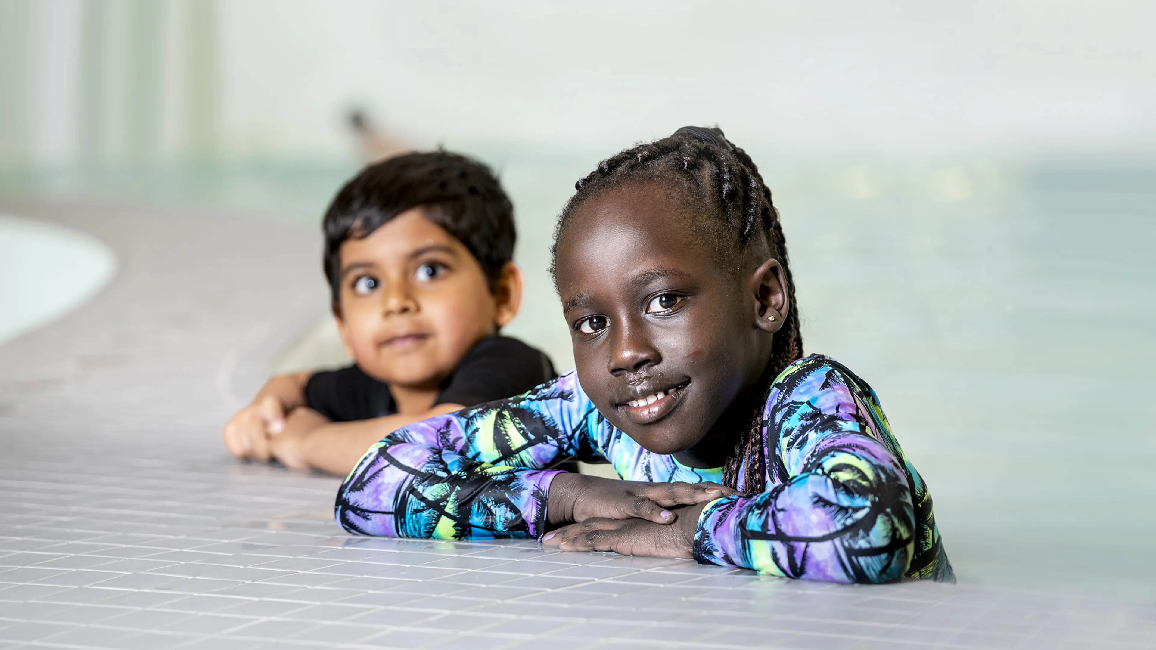 Two Children Learning to Swim