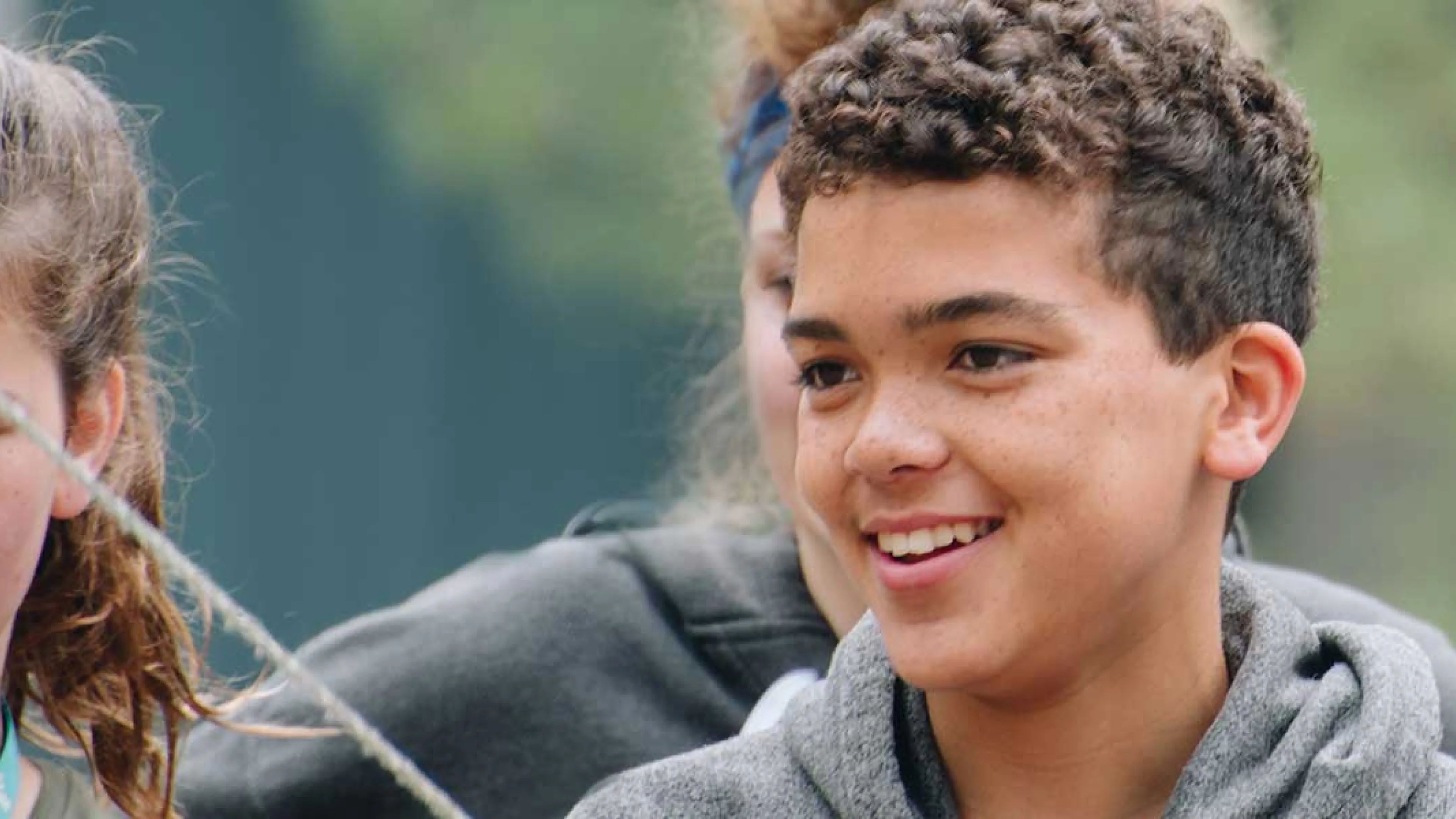 image of boy in grey hoodie