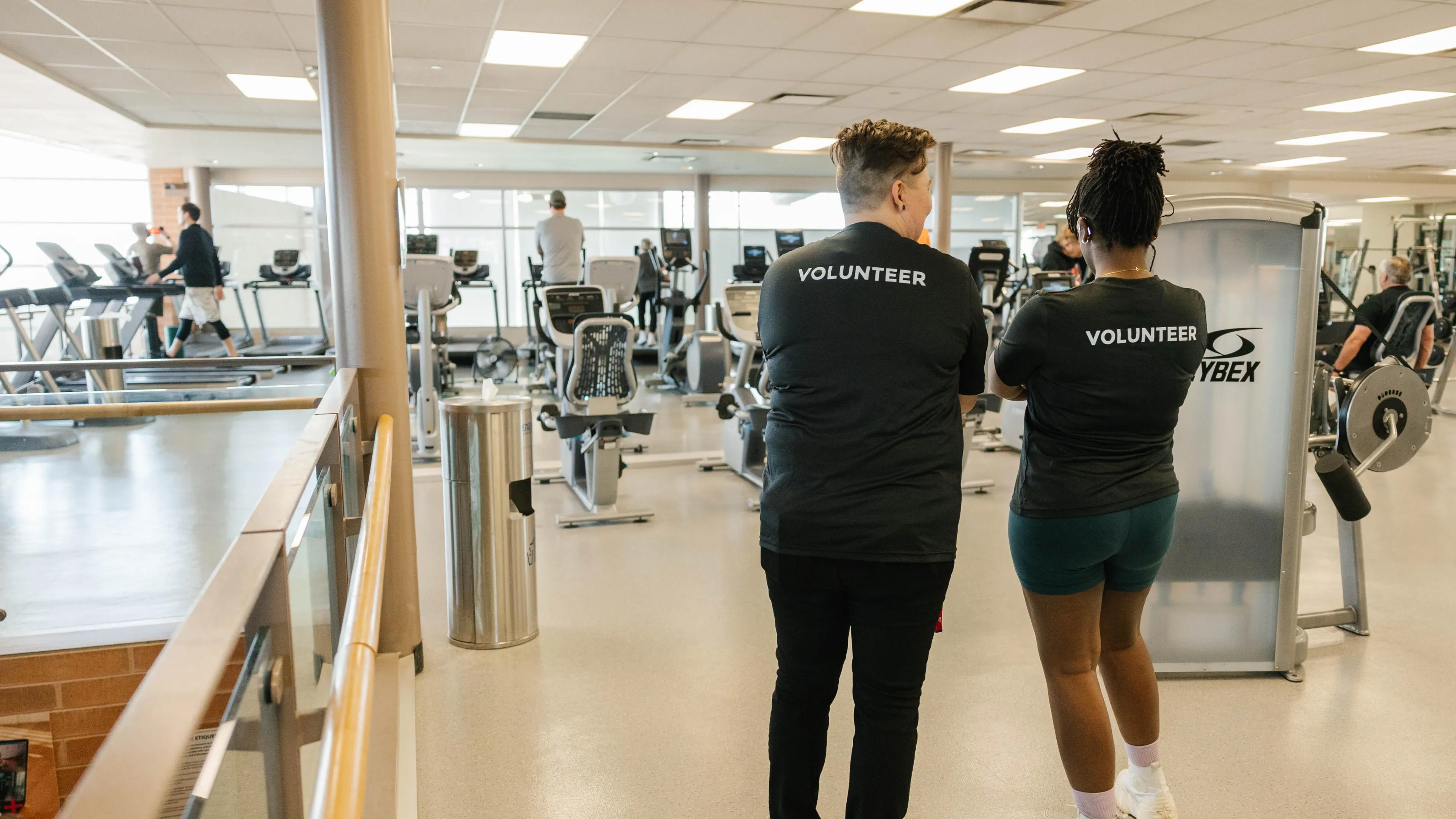 2 Y Volunteers talking, smiling with each other