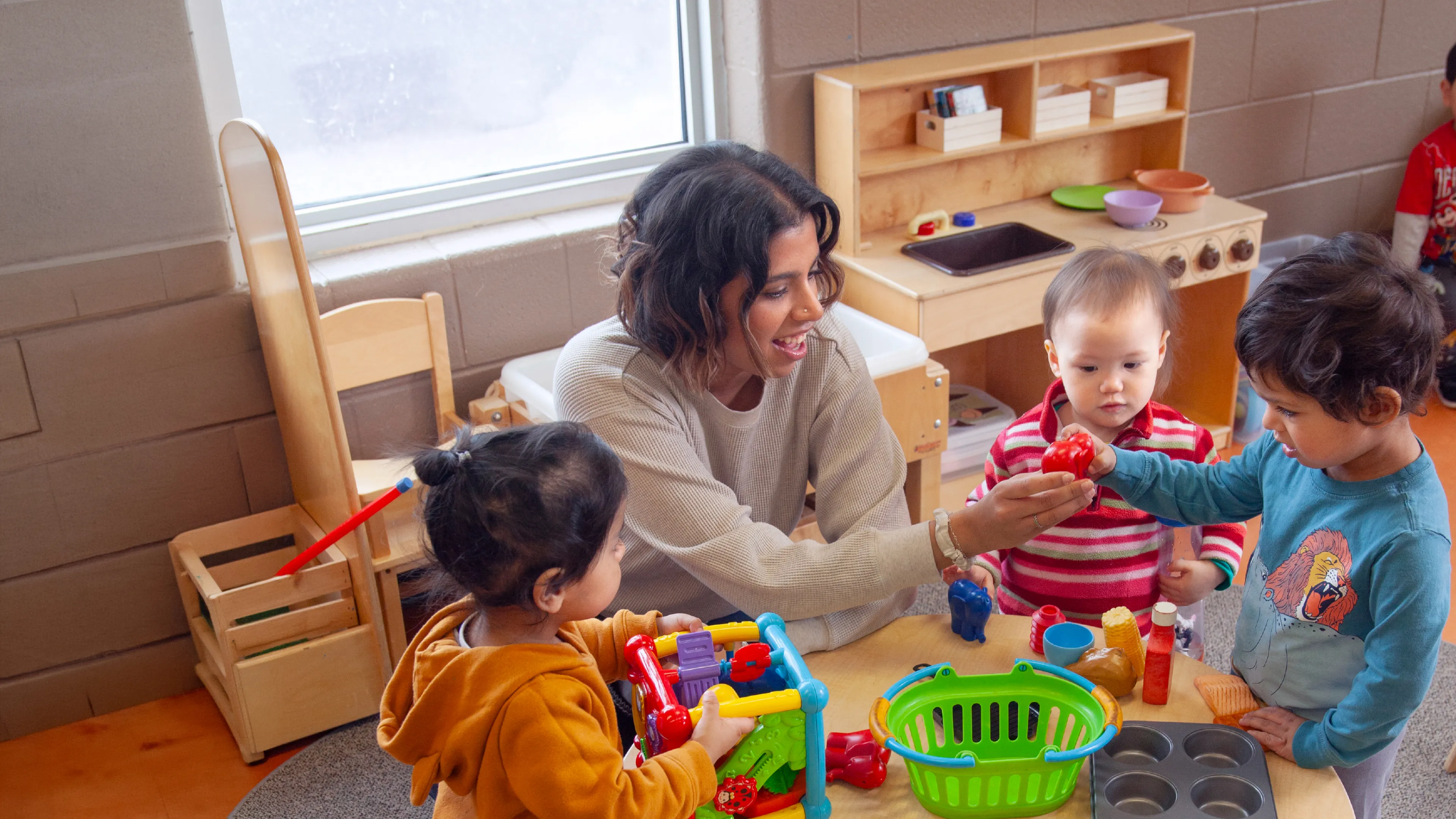 [image] ECE engageing with children at play
