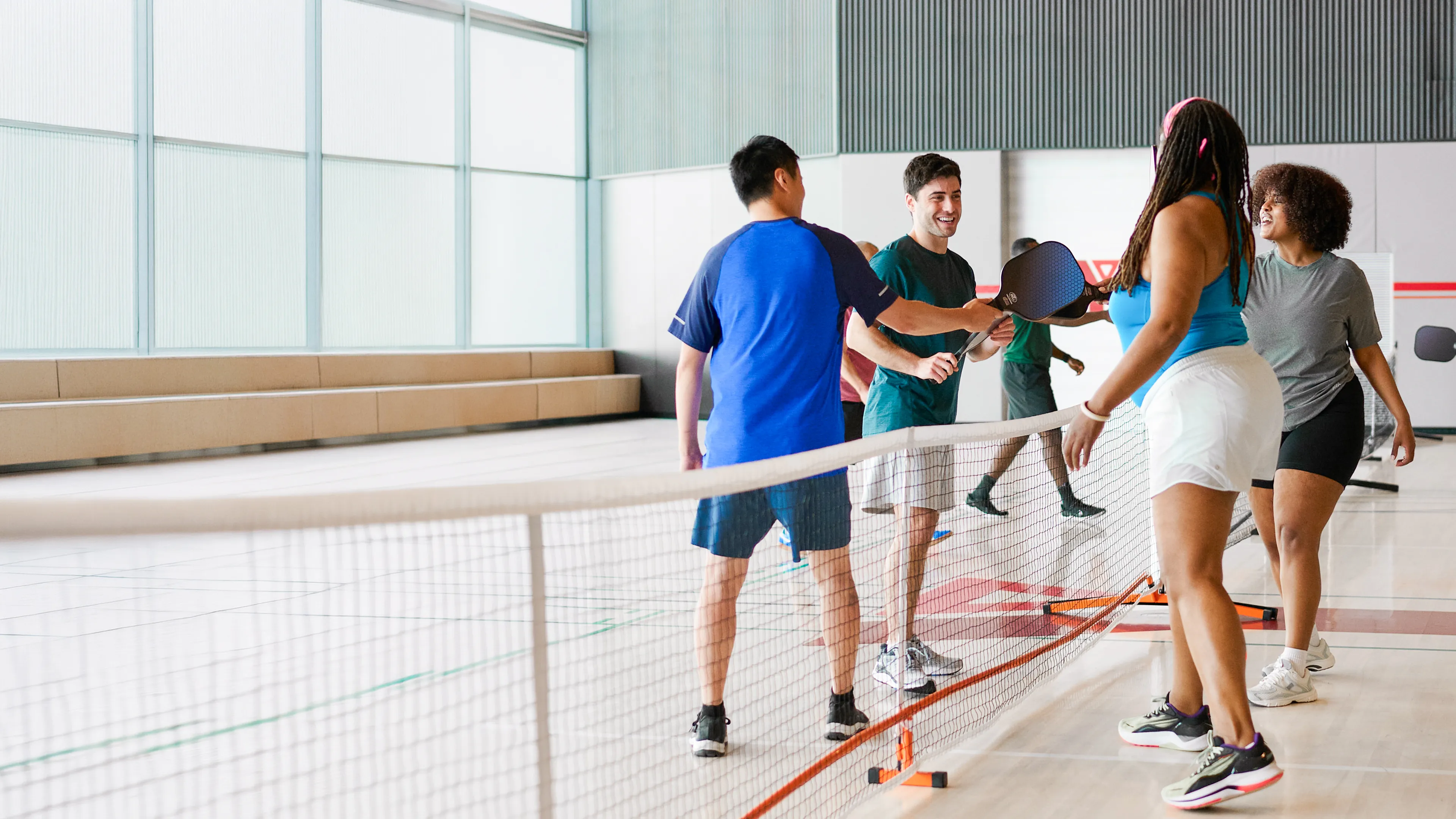 group of members playing pickleball