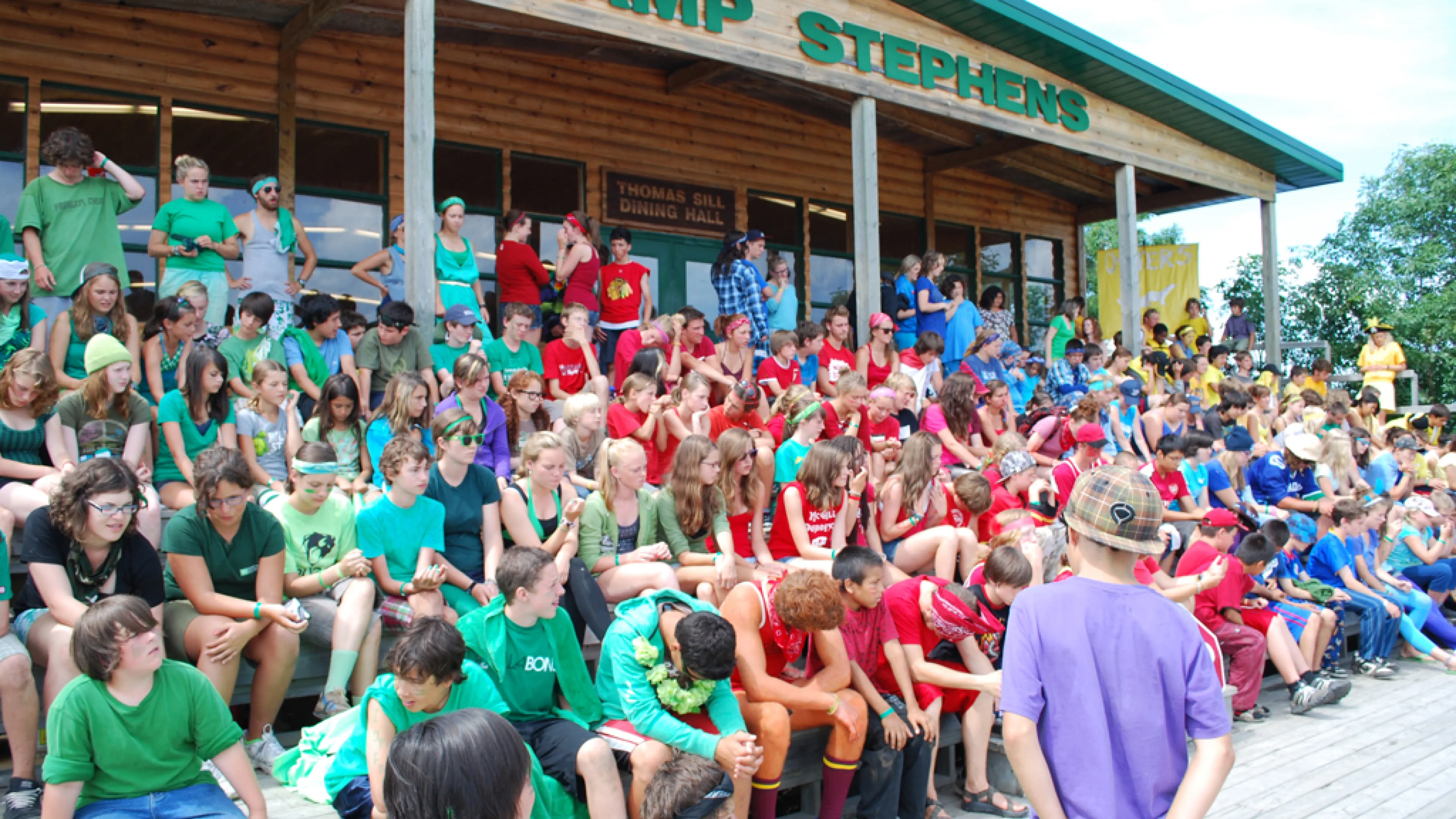 large group of students in front of Camp building