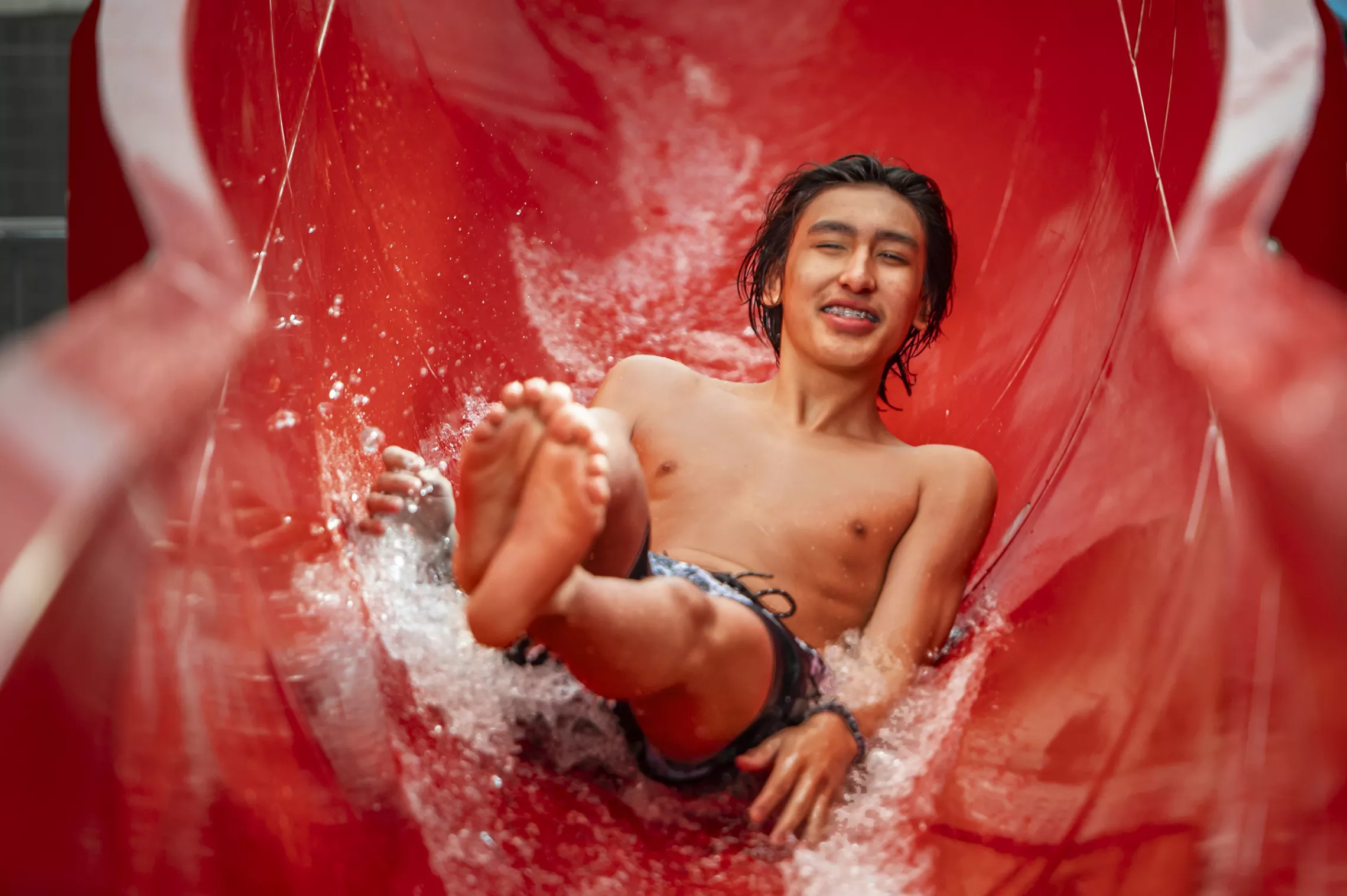 Teen on Red Waterslide