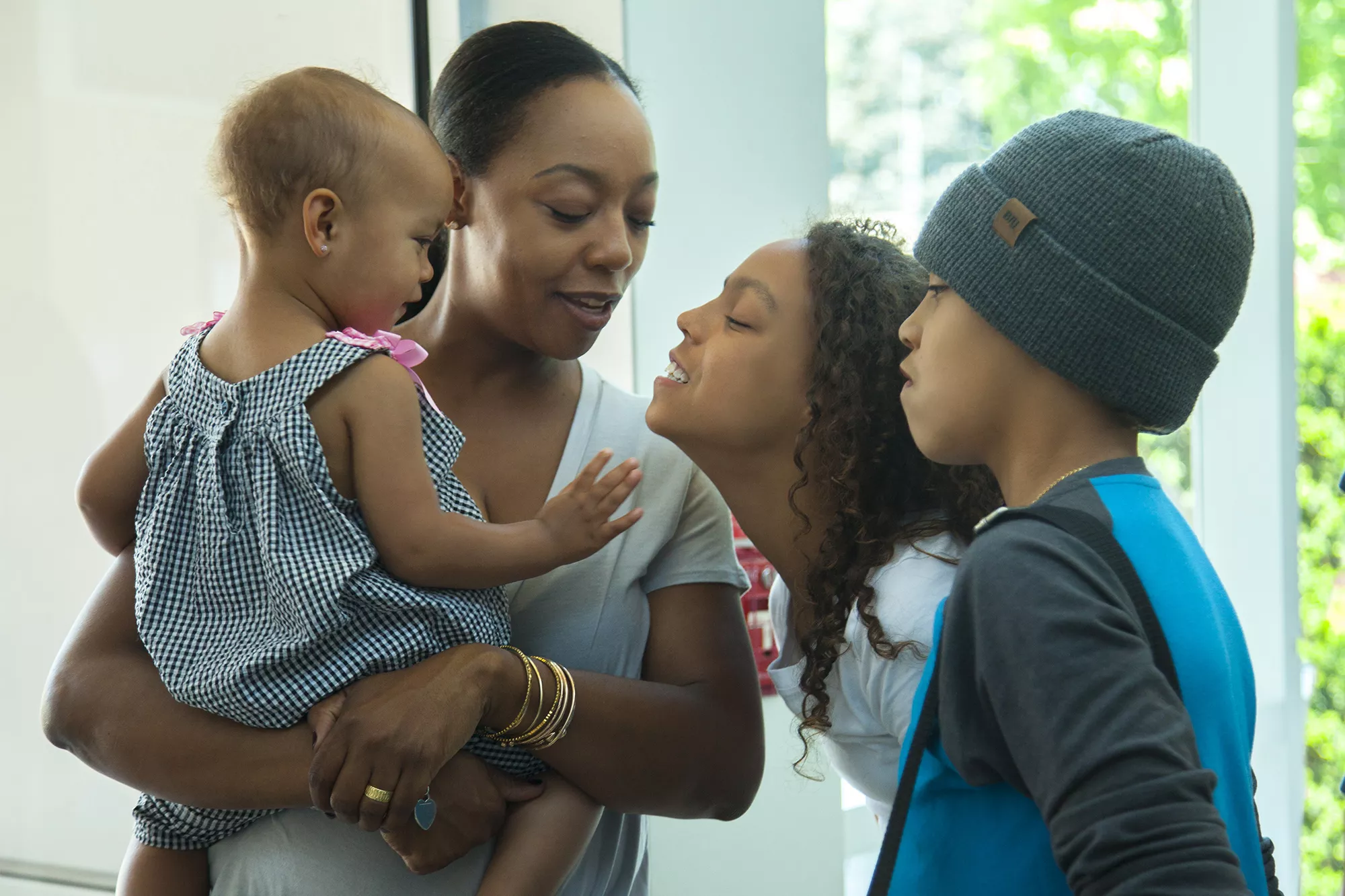 Mother with Baby and Two Children