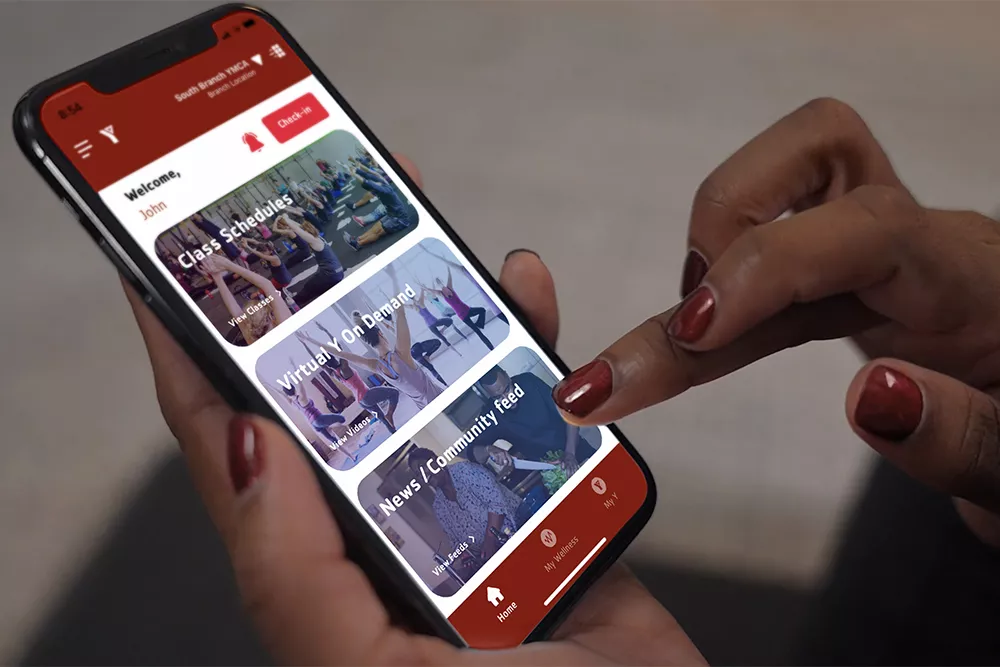 Close-up of Hands Holding Phone Using App