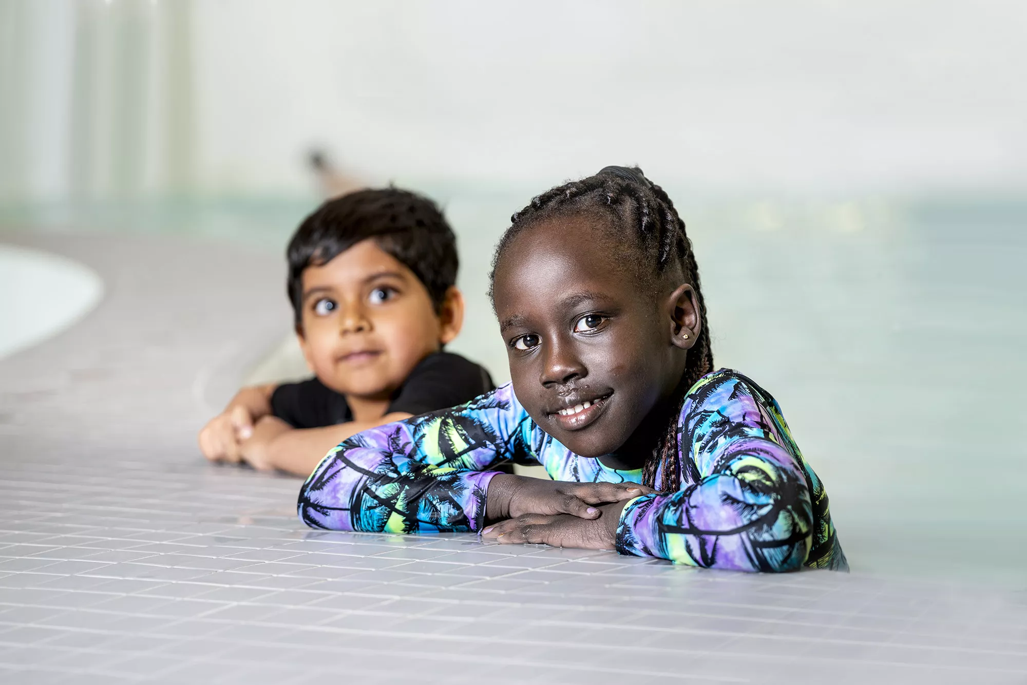 Two Children Learning to Swim