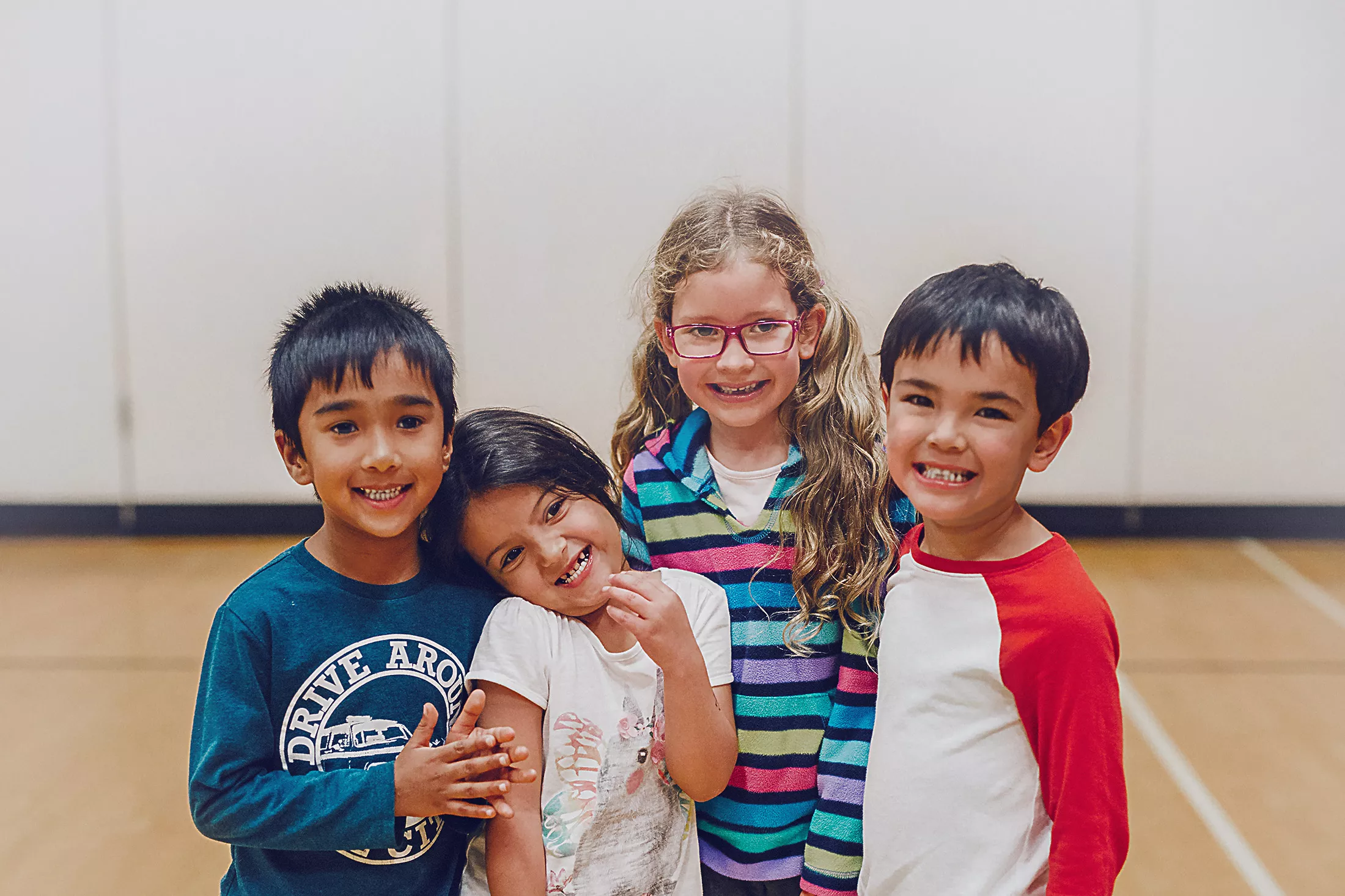 Four Kids Posing in Gymnasium