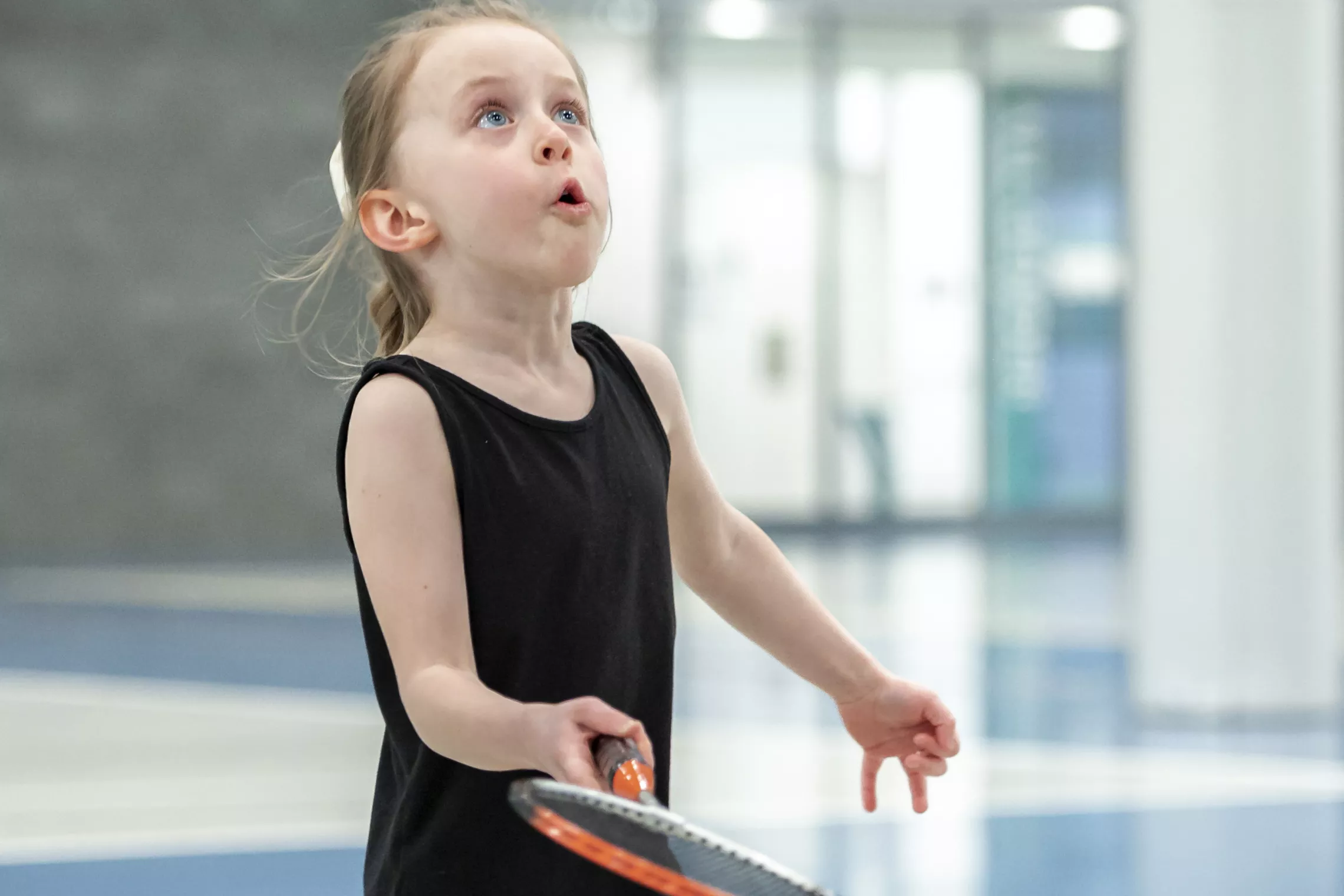 Young Girl Playing Badminton