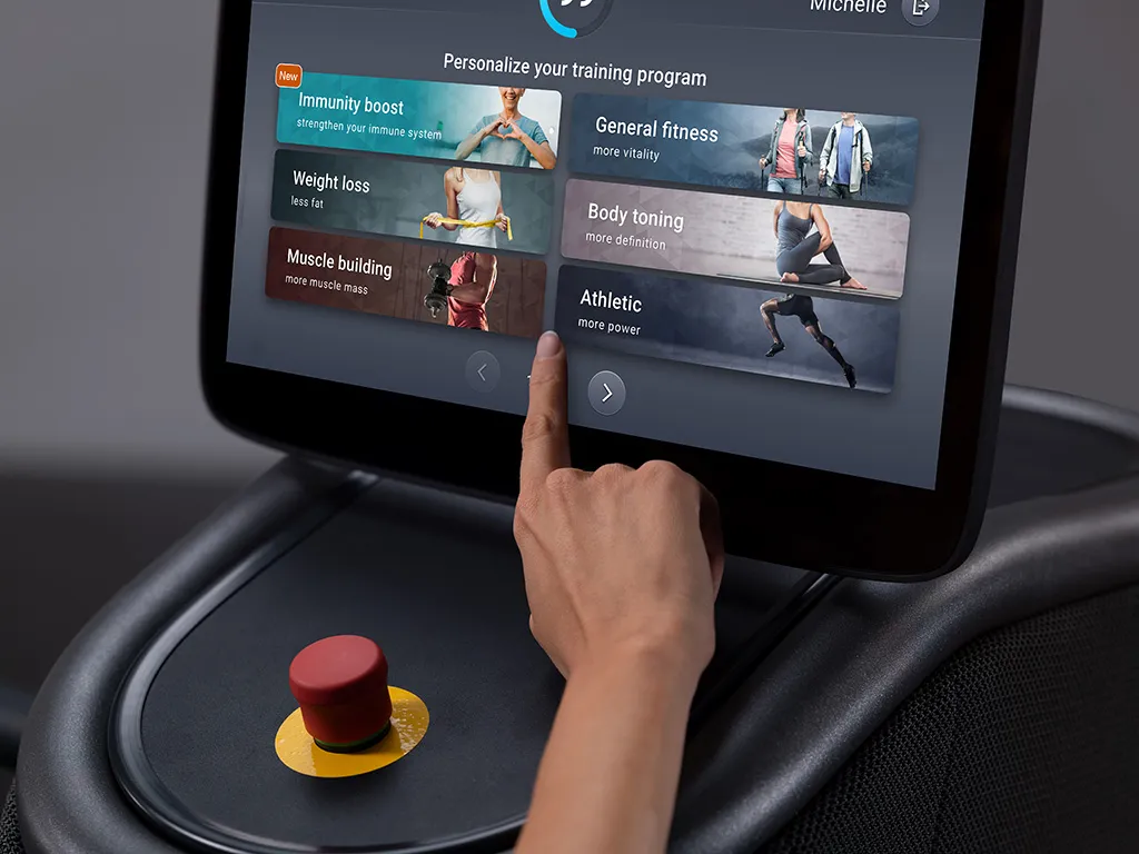hand pressing program selection on EGYM touchscreen