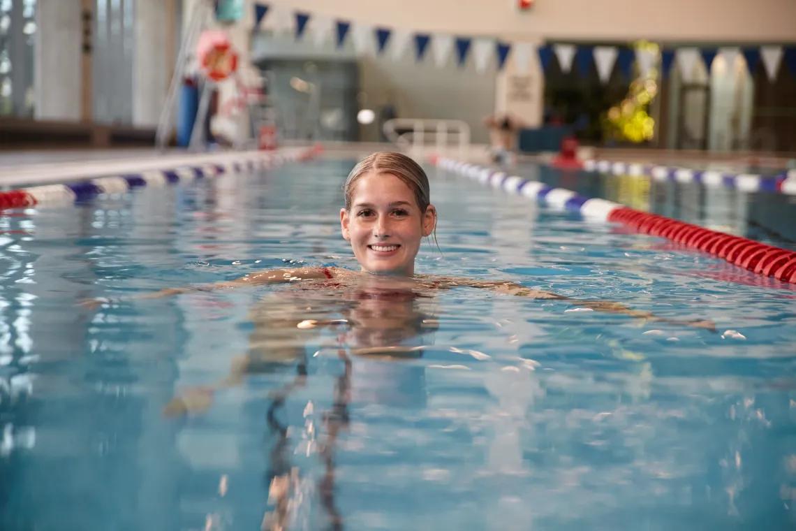 Woman in pool swim lane