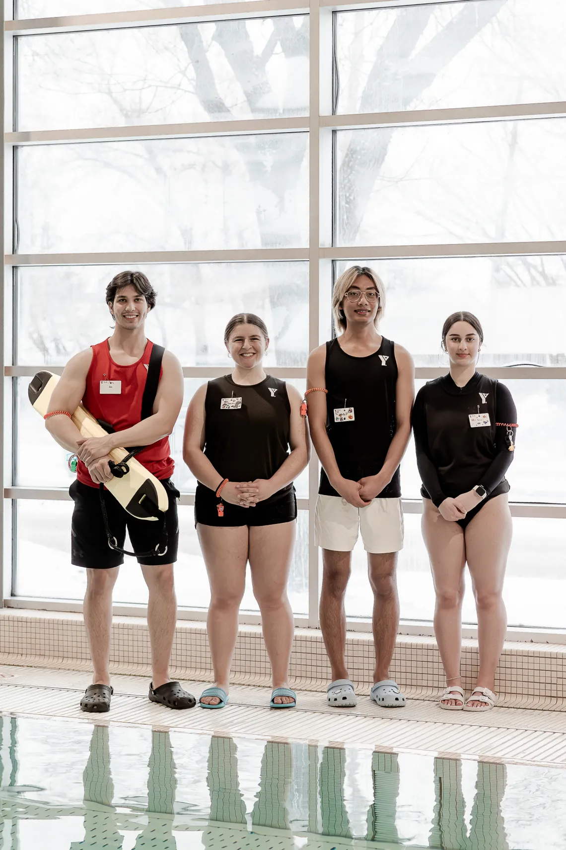 group of swim instructors and a lifeguard