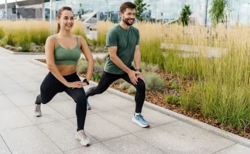 two people doing outdoor workout