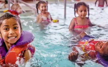 young children having fun in the pool